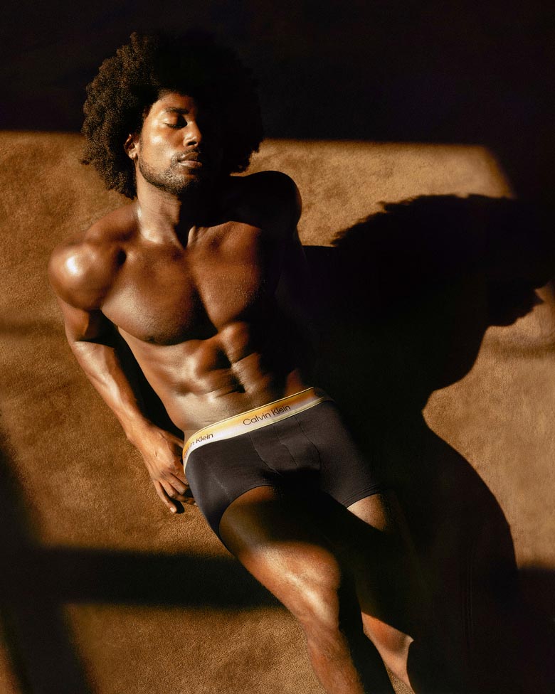 Deon Hinton posing in Calvin Klein Pride styles